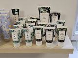 many different types of skin care products displayed on a shelf