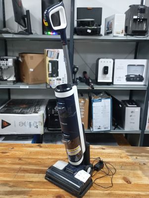 a vacuum that is sitting on a table in a room