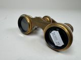 a close up of a pair of binoculars sitting on a table