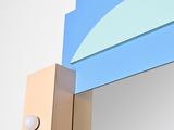 a mirror that has a blue and yellow design on it