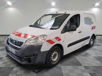 the white van is parked on a checkered floor in the garage