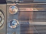 a close up of a car ' s dashboard with a clock on it
