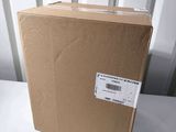 an open box sitting on top of a white table next to a wall