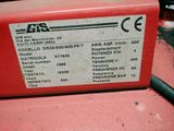 a label on the back of a red gas tank