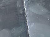 a close up view of a car ' s windshield with the rain coming down