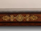 a wooden table with a marble top on it
