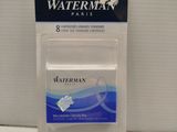 un gros plan sur un tube de dentifrice Waterman posé sur une table