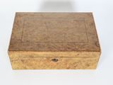 an image of a small wooden box on a white surface