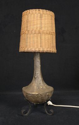 an image of a table lamp with a woven shade on it