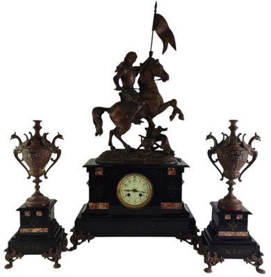 a statue of a man riding a horse on a clock