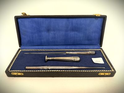 a silverware set in a blue case on a table