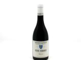 a bottle of wine that is sitting on a table