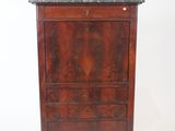 an old wooden chest of drawers with a marble top