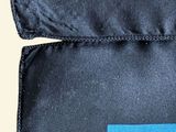 a close up of a blue and black square pattern on a blue and black square pattern