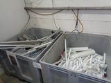 two bins filled with toilet paper in a room
