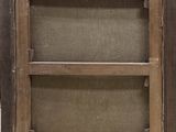 an old wooden frame with a shelf on top of it