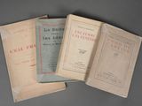 three books sitting on top of each other on top of a table