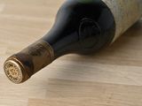 a bottle of wine that is sitting on a table