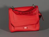 a red handbag with the word larcel on it