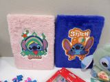 two towels and a stuffed animal on a table
