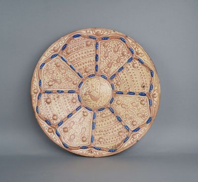 an image of a decorative plate with blue and white designs
