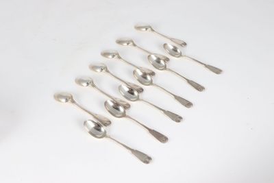 six silver spoons and two silver spoons on a white surface