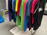 a rack of t - shirts on display in a store