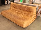 a couch that is sitting in the middle of a room