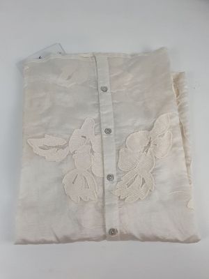 a white bag with a bird on it on a table