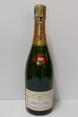 an image of a bottle of champagne on a white table