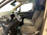 the interior of a car with the door open and the driver ' s seat down