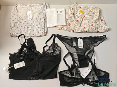 three lingersuits and a bra top on a table