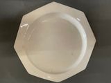 a white plate that is sitting on a table