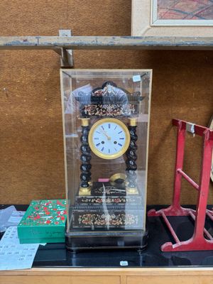 a clock that is sitting on top of a table