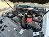 a car engine with a red battery in it