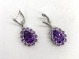 paire de boucles d'oreilles en améthorate et topaze blanche
