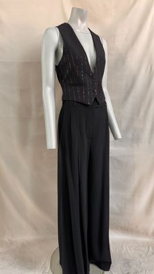 black sleeveless jumpsuit with beaded waist and waist tie