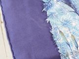 a close up of a piece of fabric with a bird on it