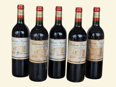 six bottles of wine are lined up in a row