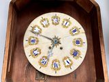 a clock that is sitting in a box on the floor