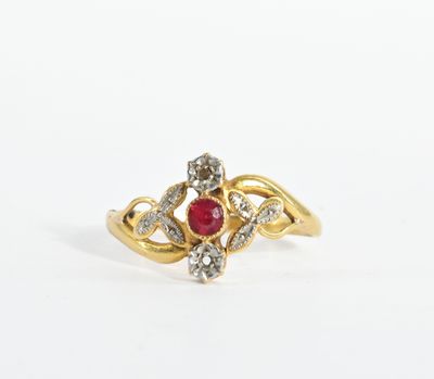 an image of a gold ring with a ruby stone and diamonds