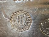 an image of a close up of a metal object with a coin on it