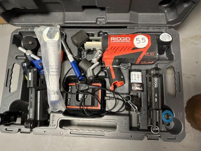 a tool kit in a toolbox with tools in it