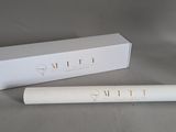 a close up of a tube of mascara next to a box