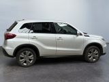 a picture of a white suv parked in a room