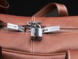 a close up of a brown leather bag with a zipper