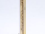 a tall wooden pole with a clock on top of it