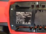 a close up of the battery compartment of a red motorcycle