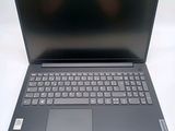 a close up of a laptop with a keyboard on a white surface