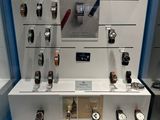 many different watches on display in a glass case